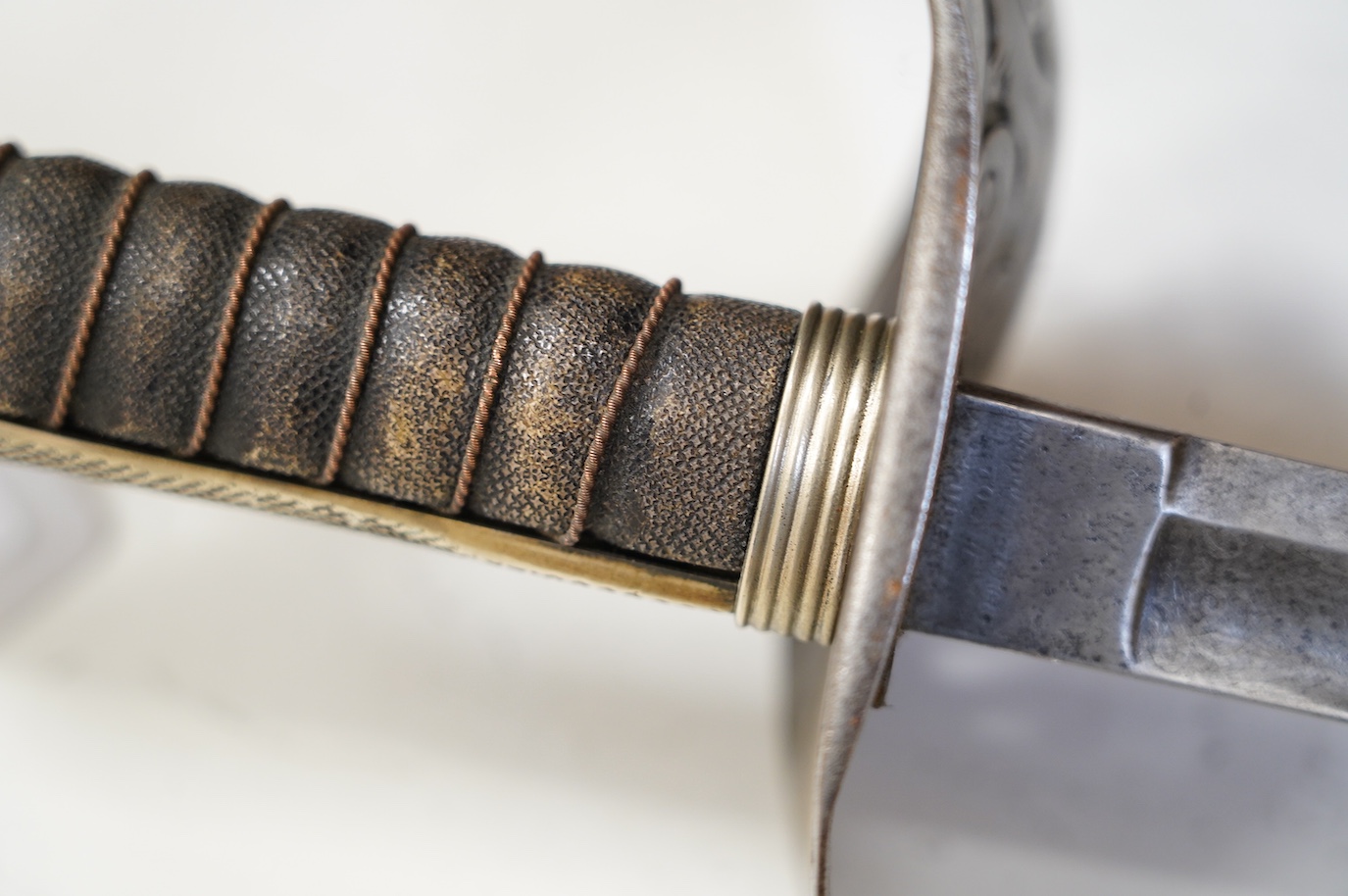 An 1897 pattern infantry officer’s sword, blade etched with crowned VR cypher, steel guard with GVR cypher, blade 83cm. Condition - fair, generally worn